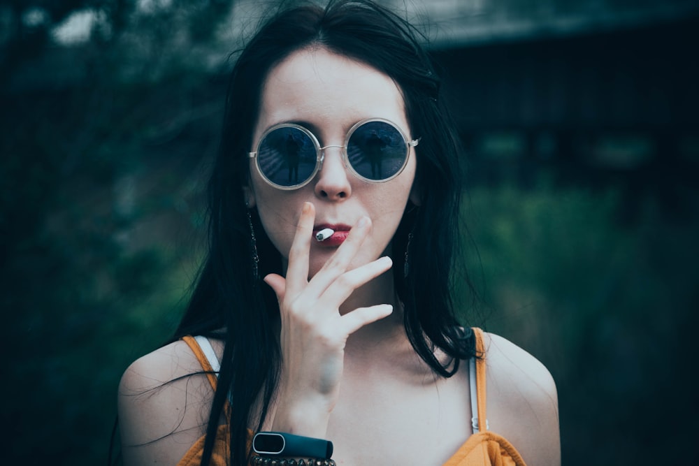 woman smoking at daytime