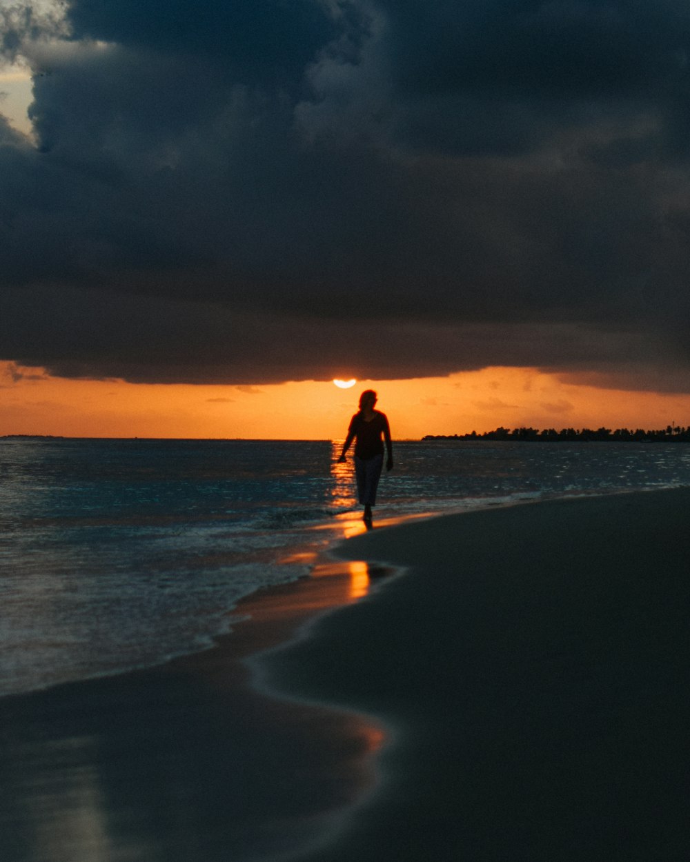 woman walking on beach