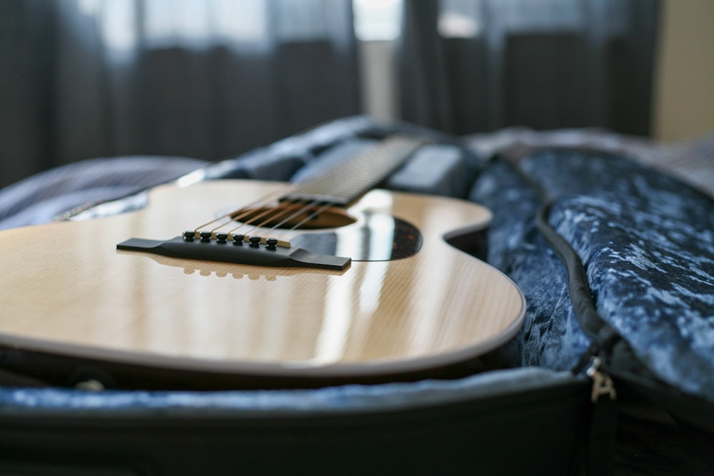 brown guitar in case