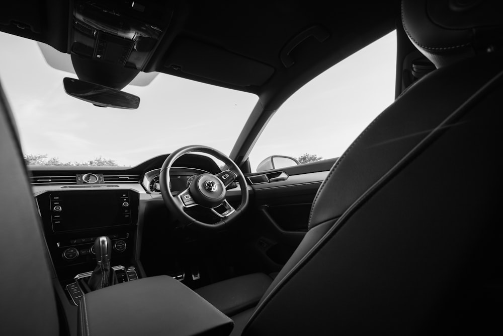 greyscale photo of steering wheel