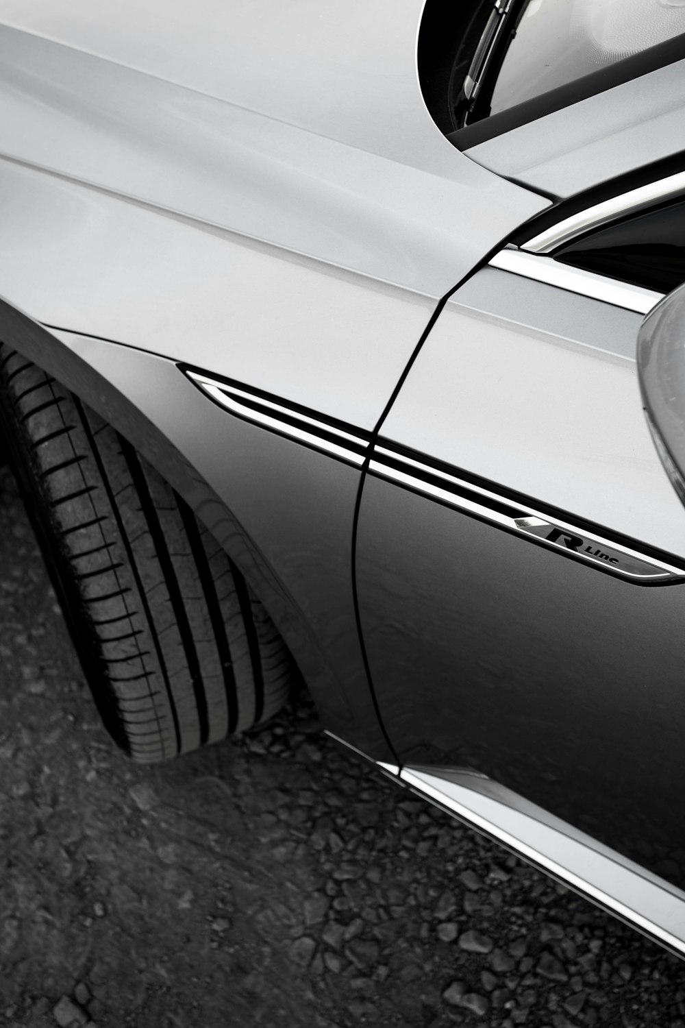 a black and white photo of a car door handle