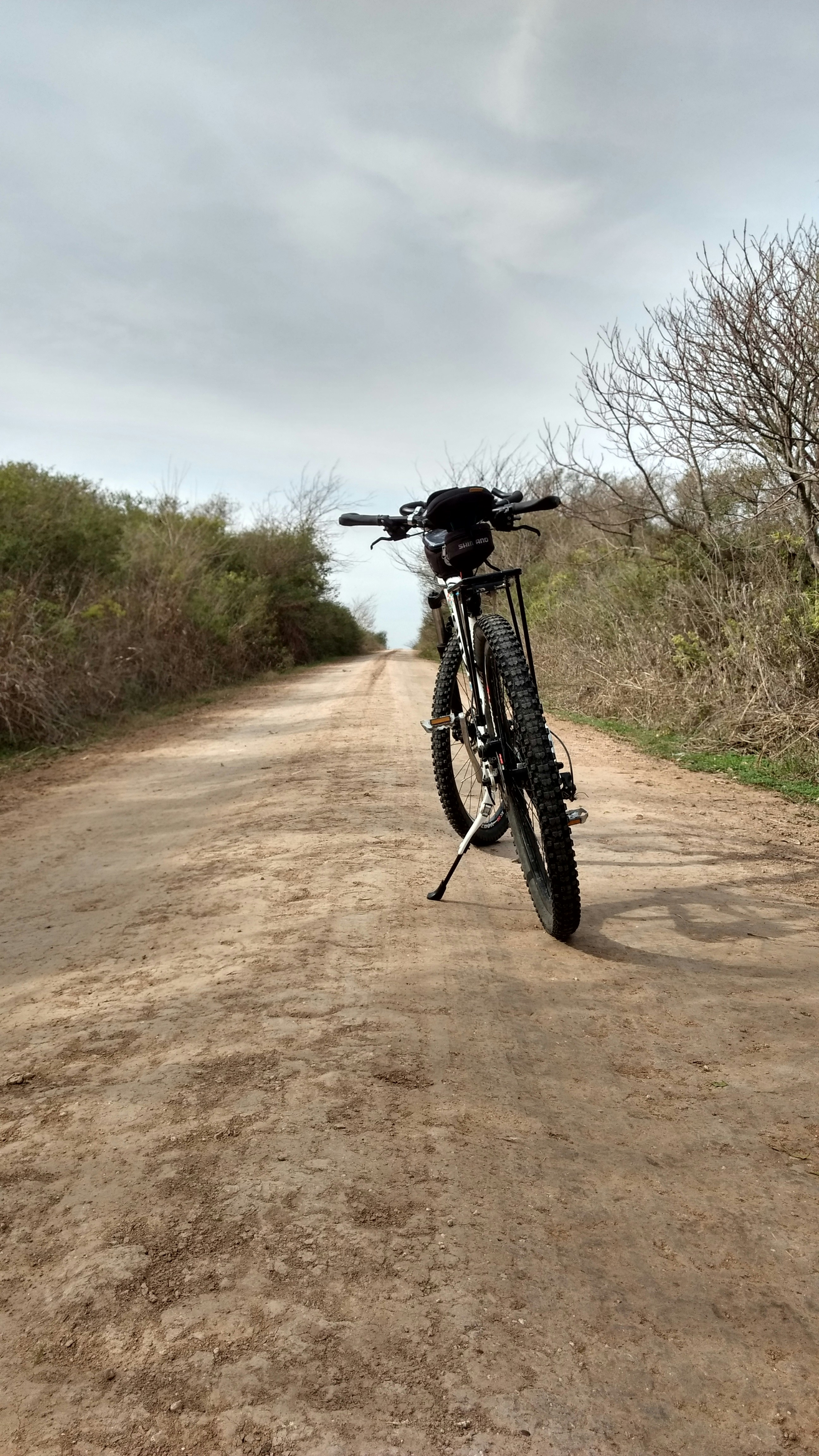 black bicycle on paved road