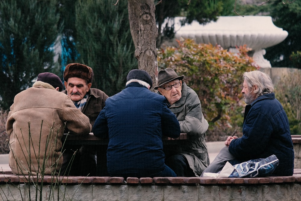 unknown persons sitting outdoors