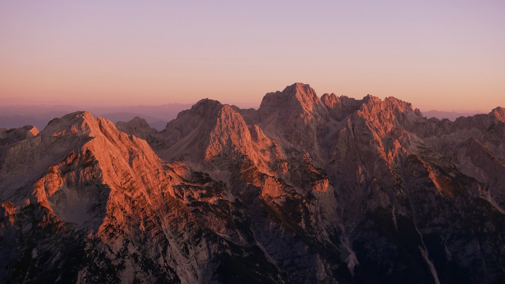 snow-covered mountain at golden hour