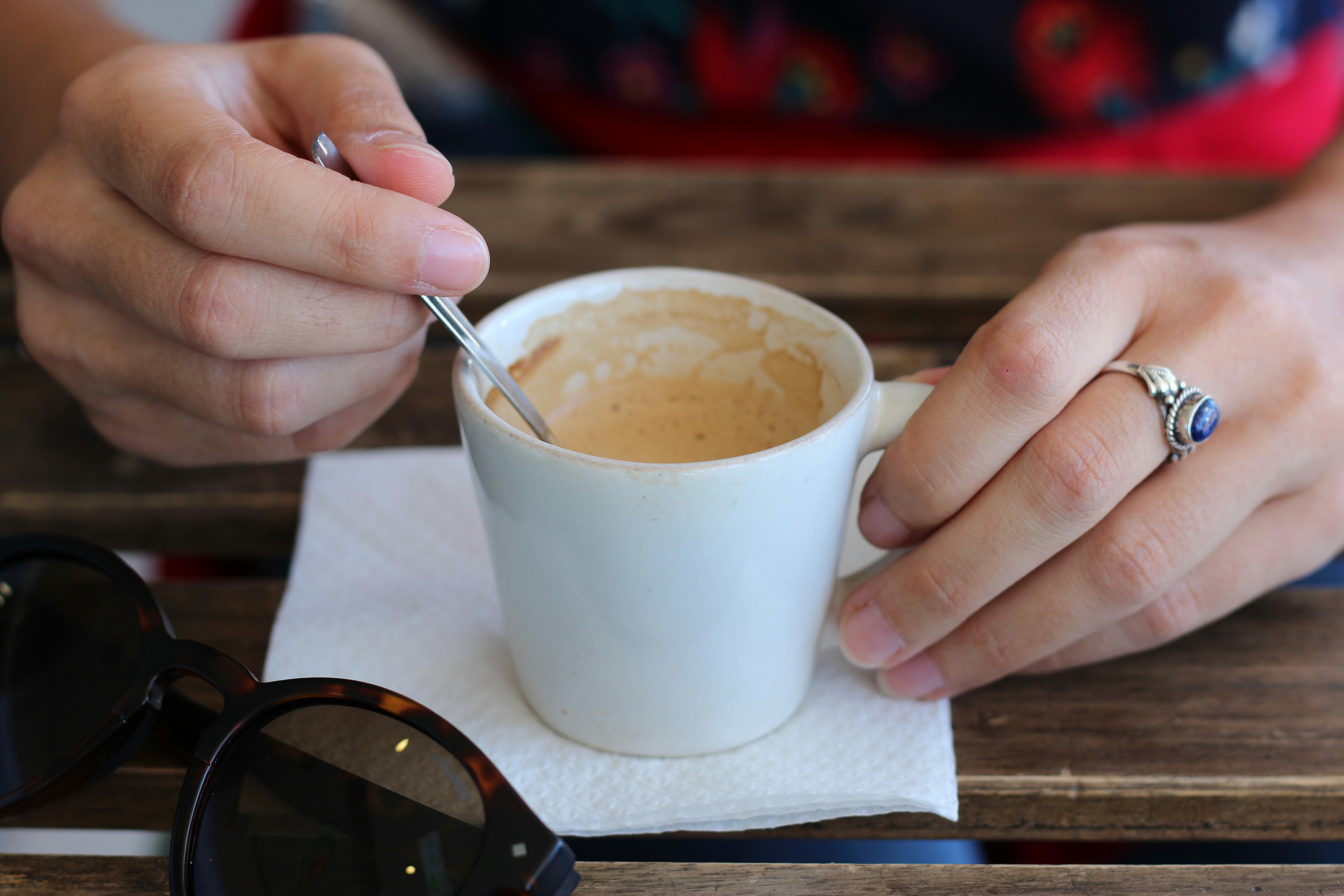 person holding white ceramic mug