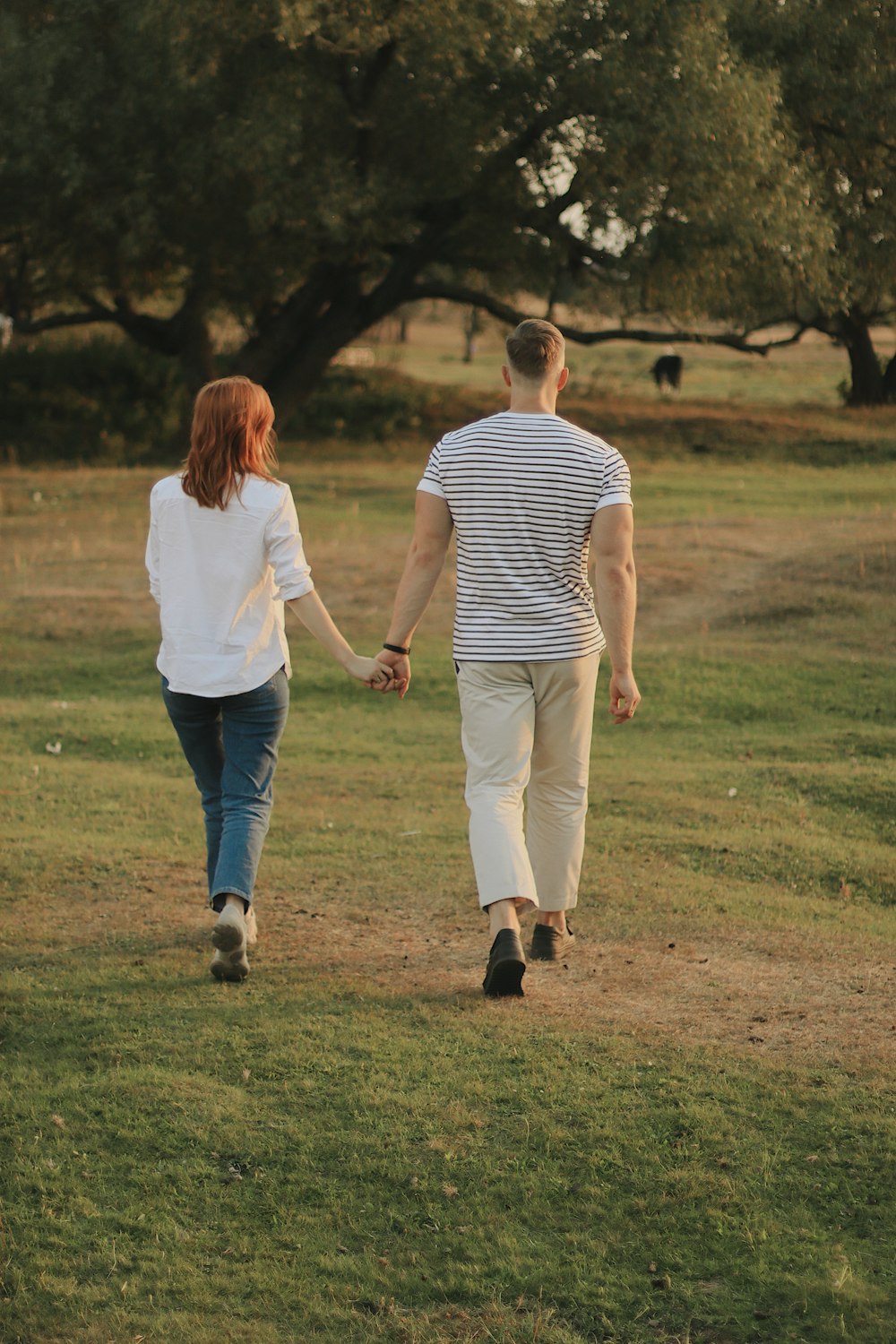 woman and man holding each others hands