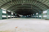Interior shot of a spacious, well-lit warehouse ready for rent