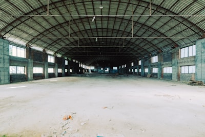 Interior of a spacious warehouse with high ceilings.