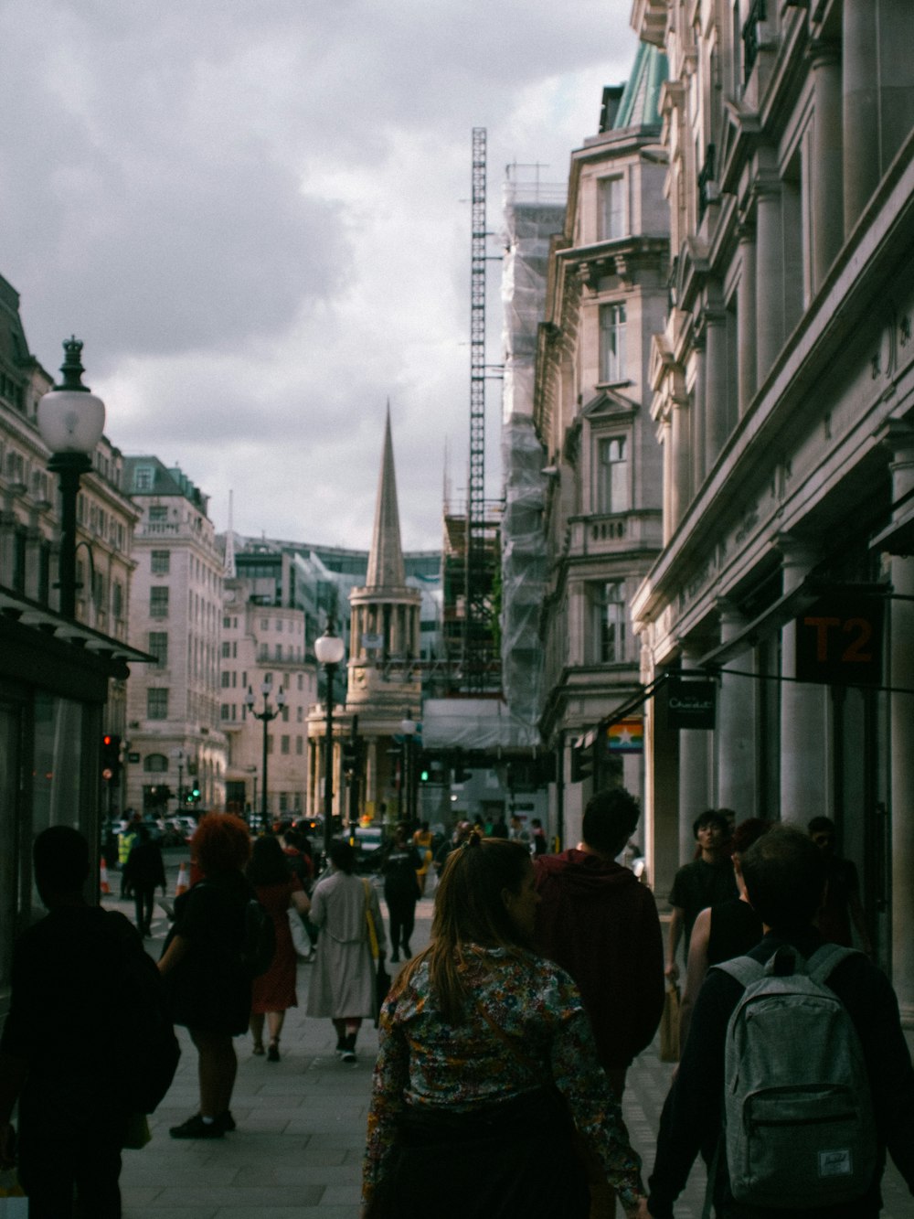 people surrounded by buildings