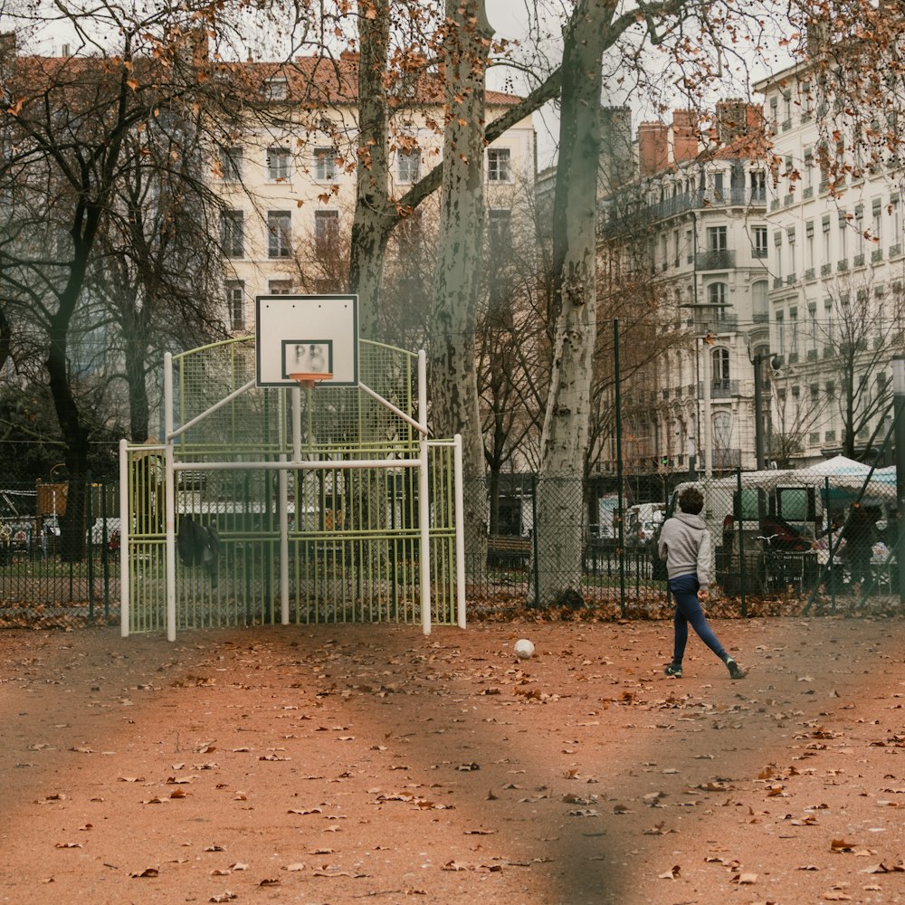 boy standing near basketball hoop