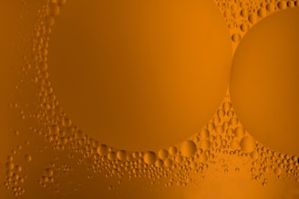 a close up of bubbles on a yellow background