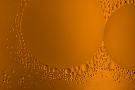 a close up of bubbles on a yellow background