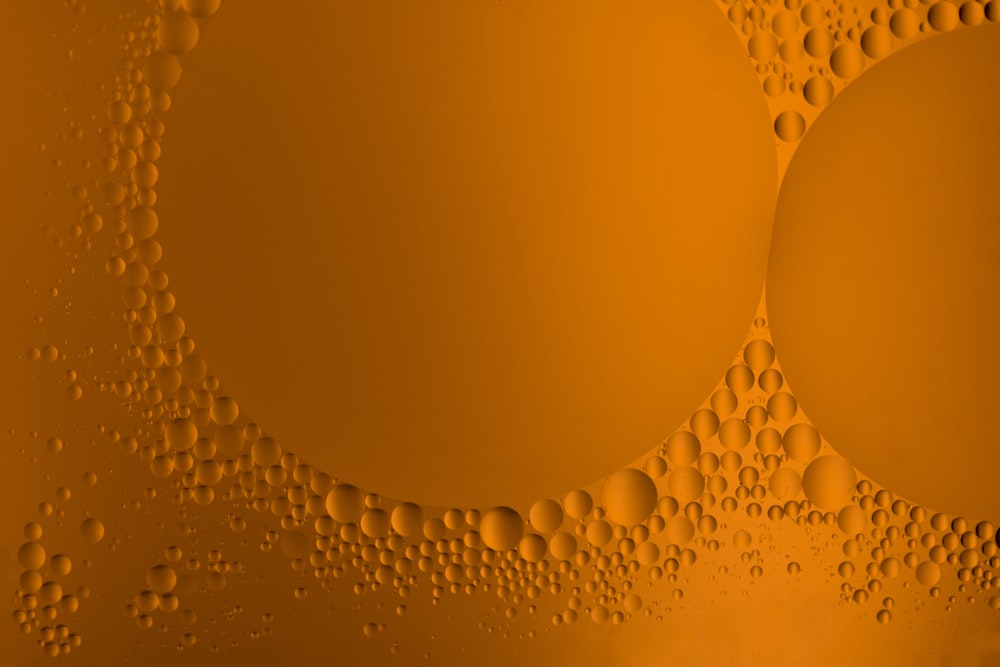 a close up of bubbles on a yellow background