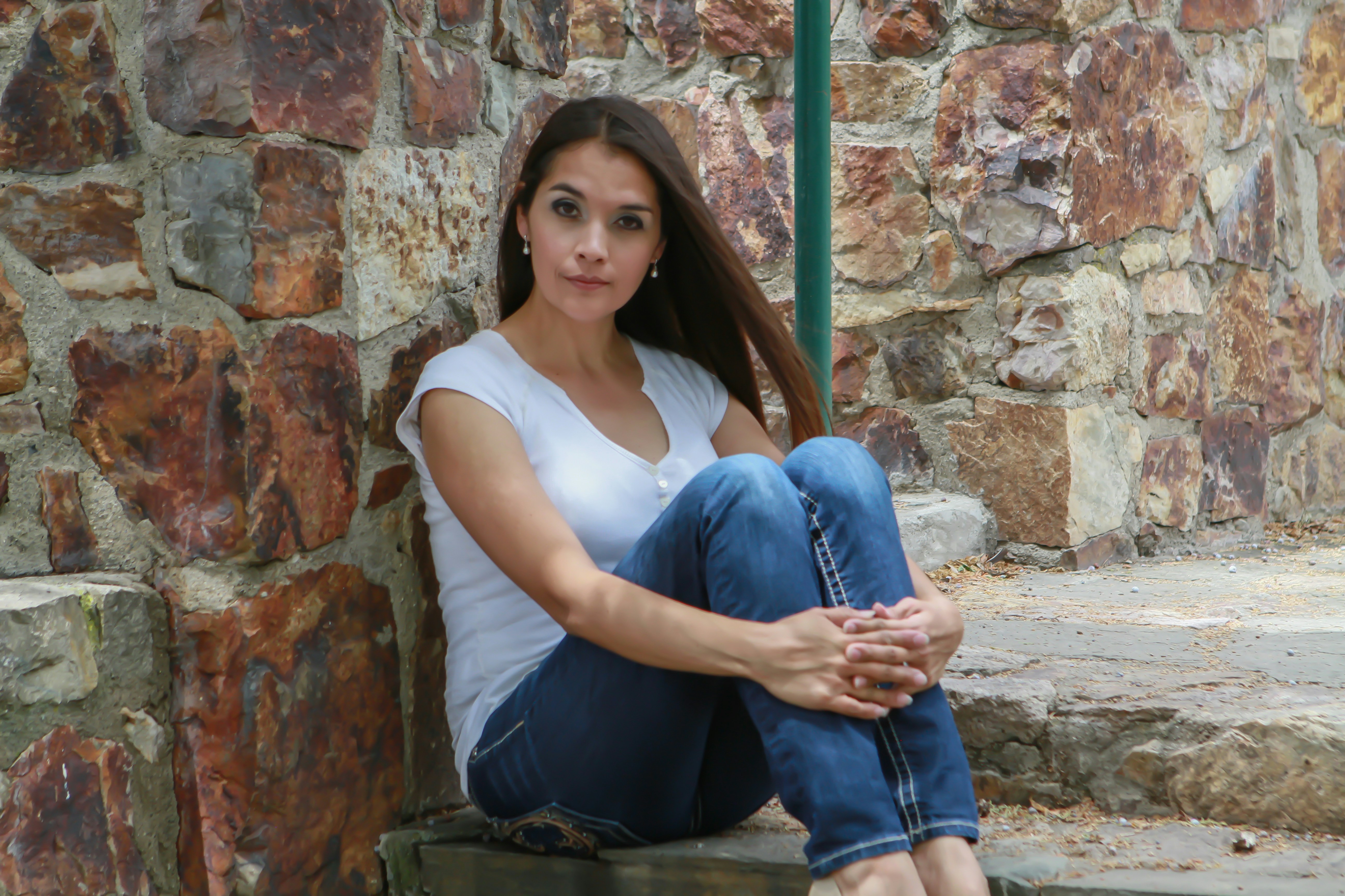 woman sitting on concrete stairs gorgeous teams background