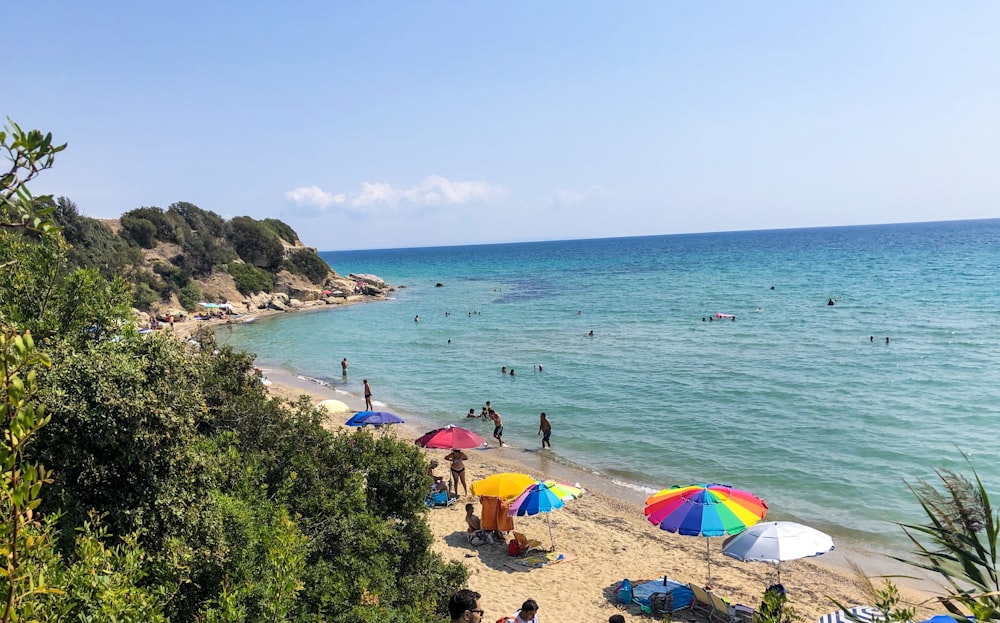 patio umbrellas on shore at daytime