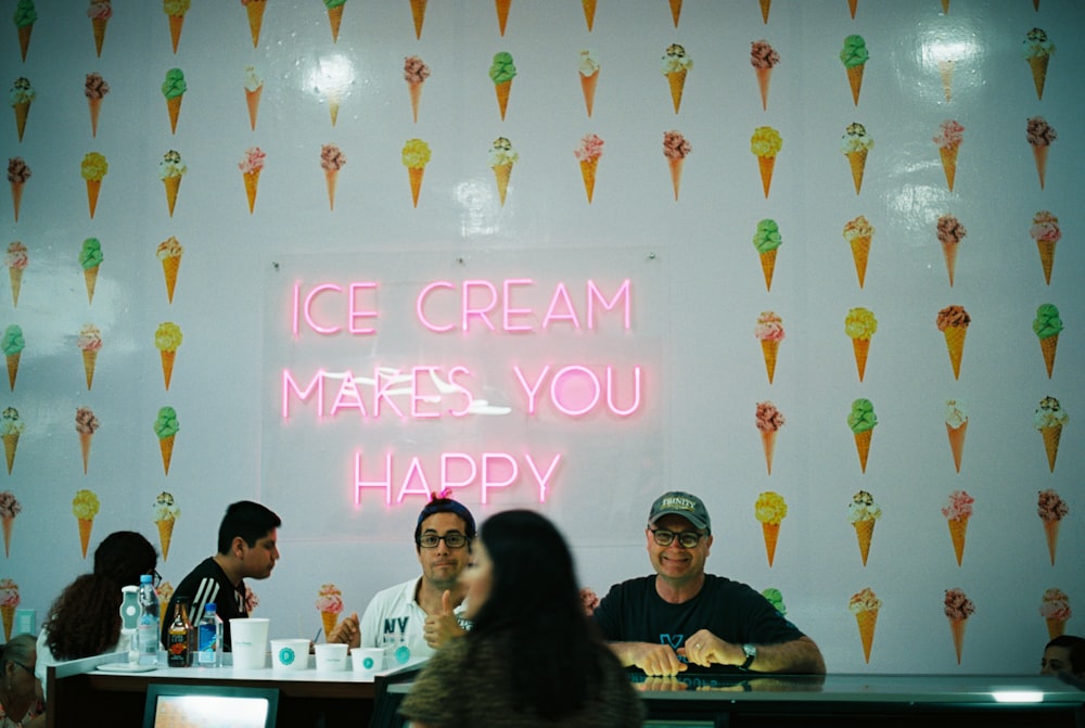 group of men and women inside ice cream restaurant