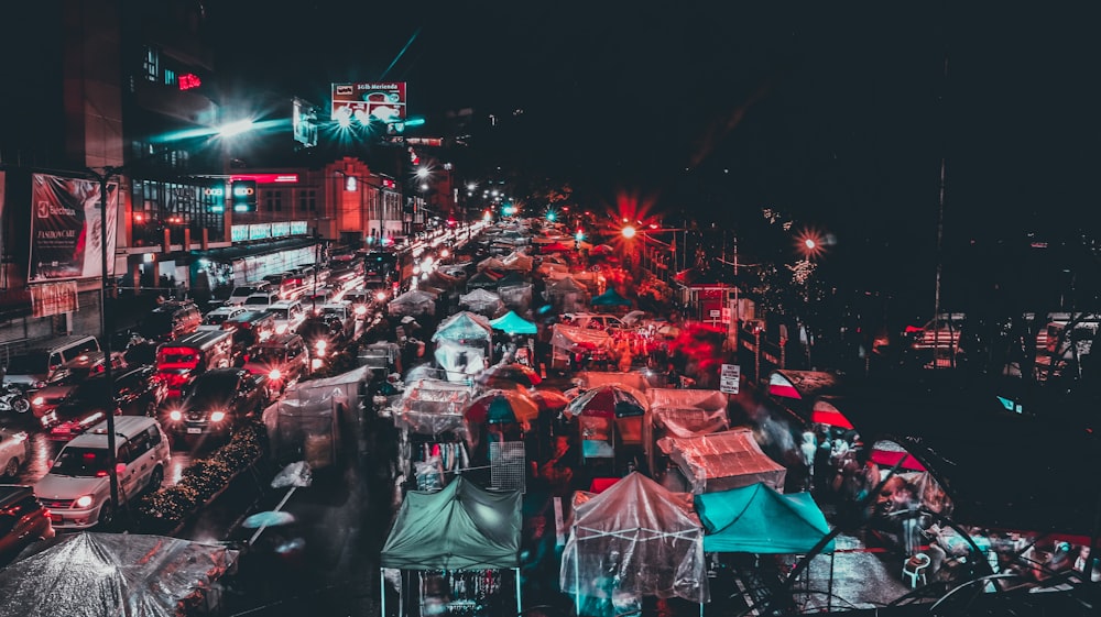 a city street filled with lots of traffic at night