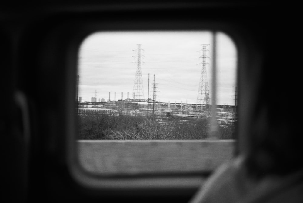 a person looking out of a train window