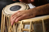 a close up of a person playing a musical instrument