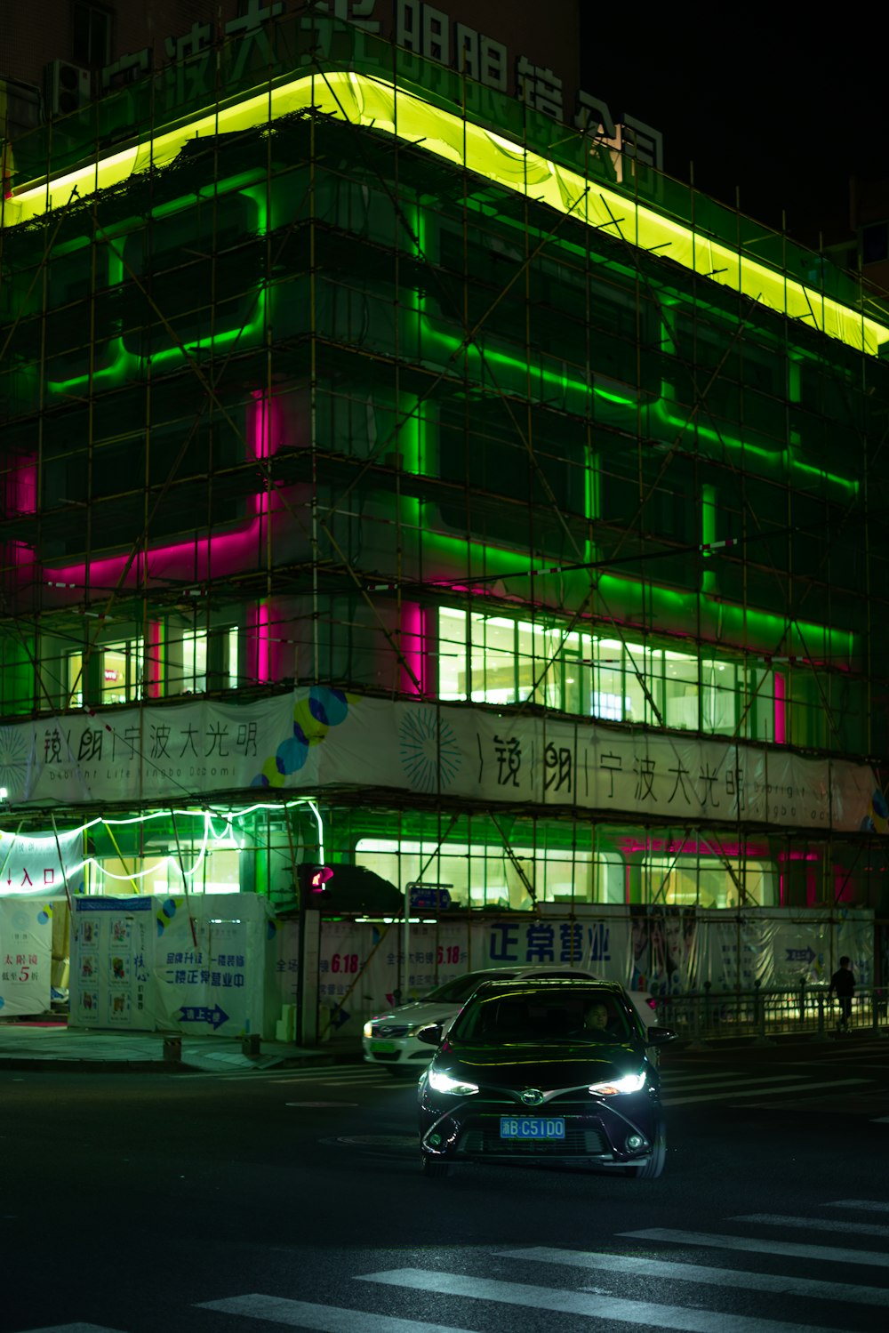 lighted concrete building at night time