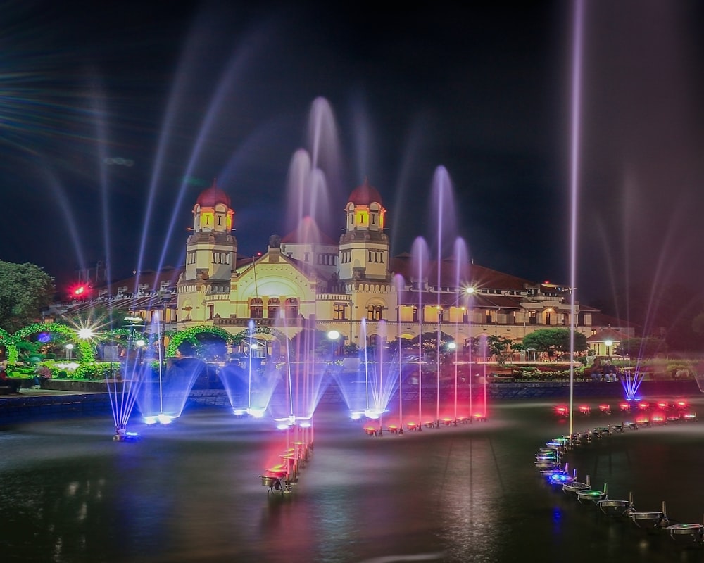 blue and red outdoor fountains during night time