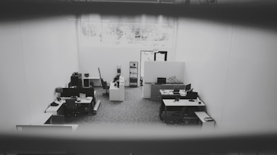 Bright, clean office interior with natural light highlighting spotless surfaces and organized desks.