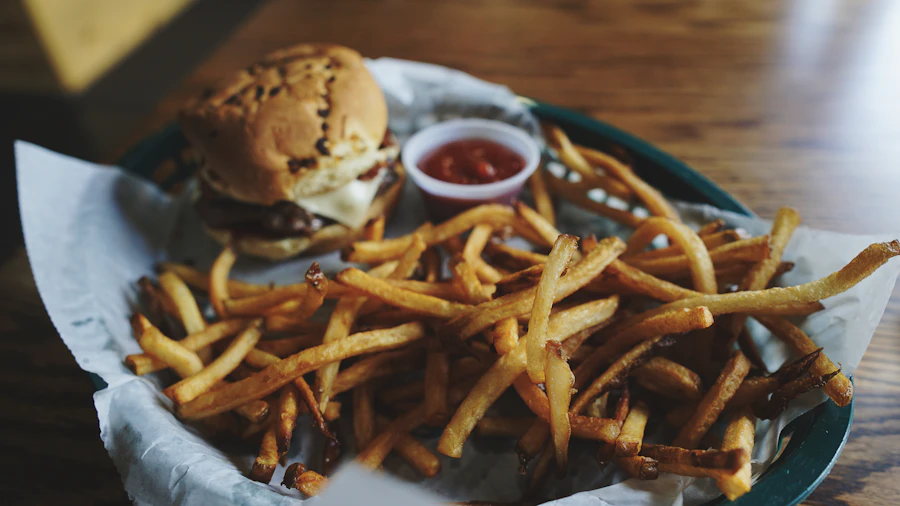 A fresh burger and hand-cut fries at a fast-casual counter