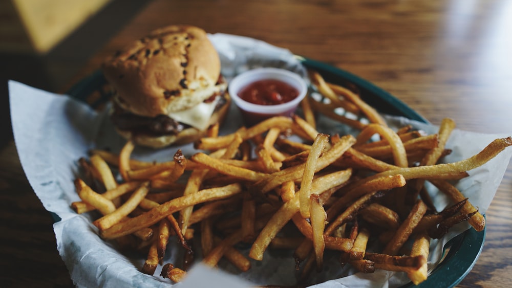 fries and burger on tray