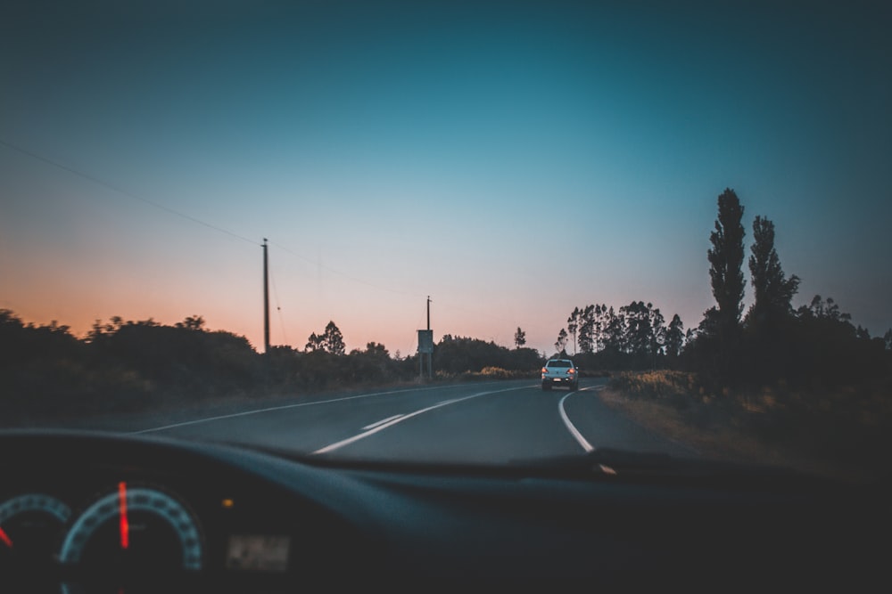 white pickup truck on roadway during daytime