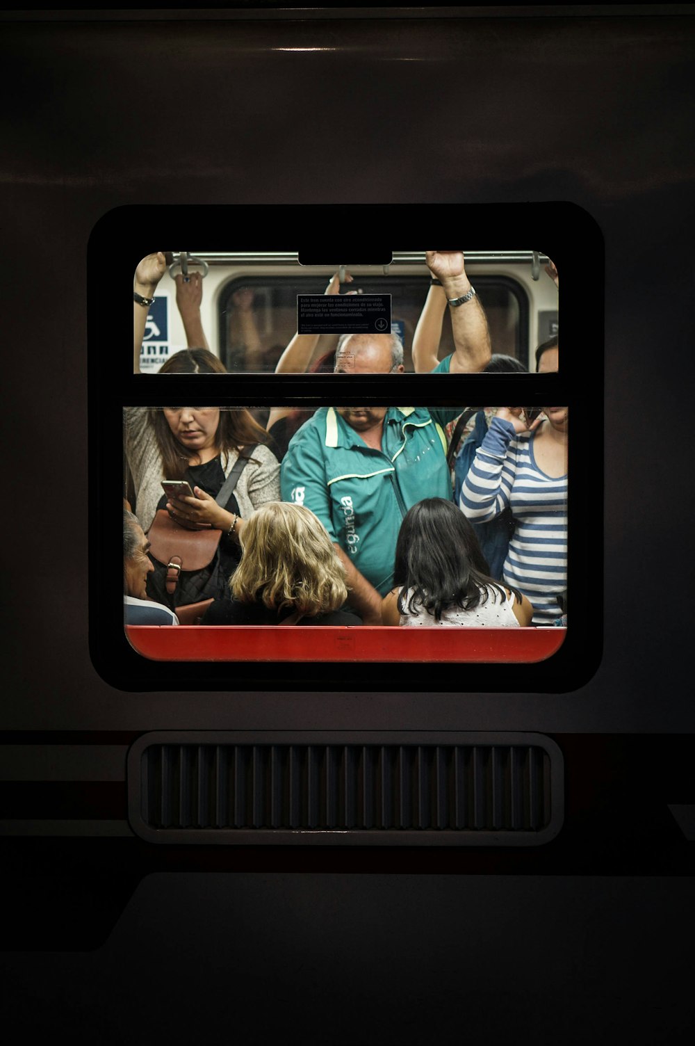 people standing in a train car