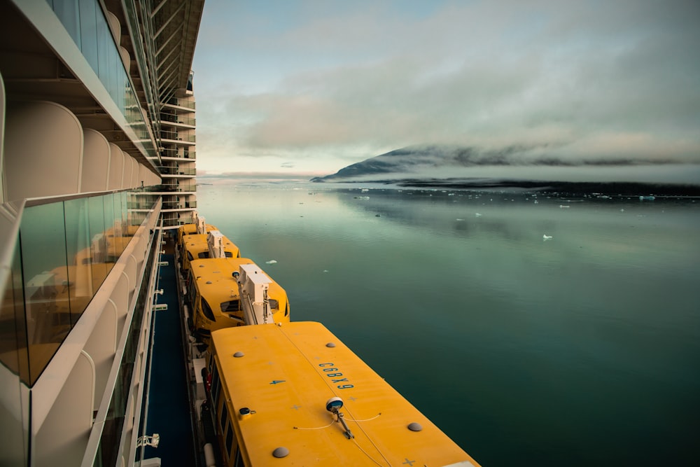 architectural photography of yellow and white ship