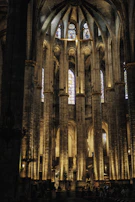 Visitors admiring the soaring columns inside the basilica, bathed in soft natural light.