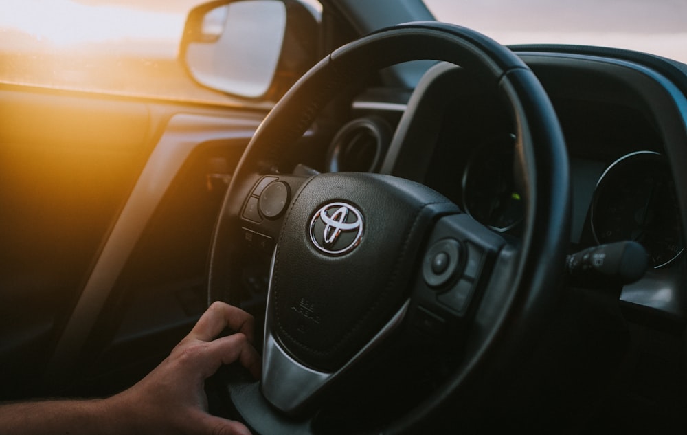 black Toyota vehicle steering wheel
