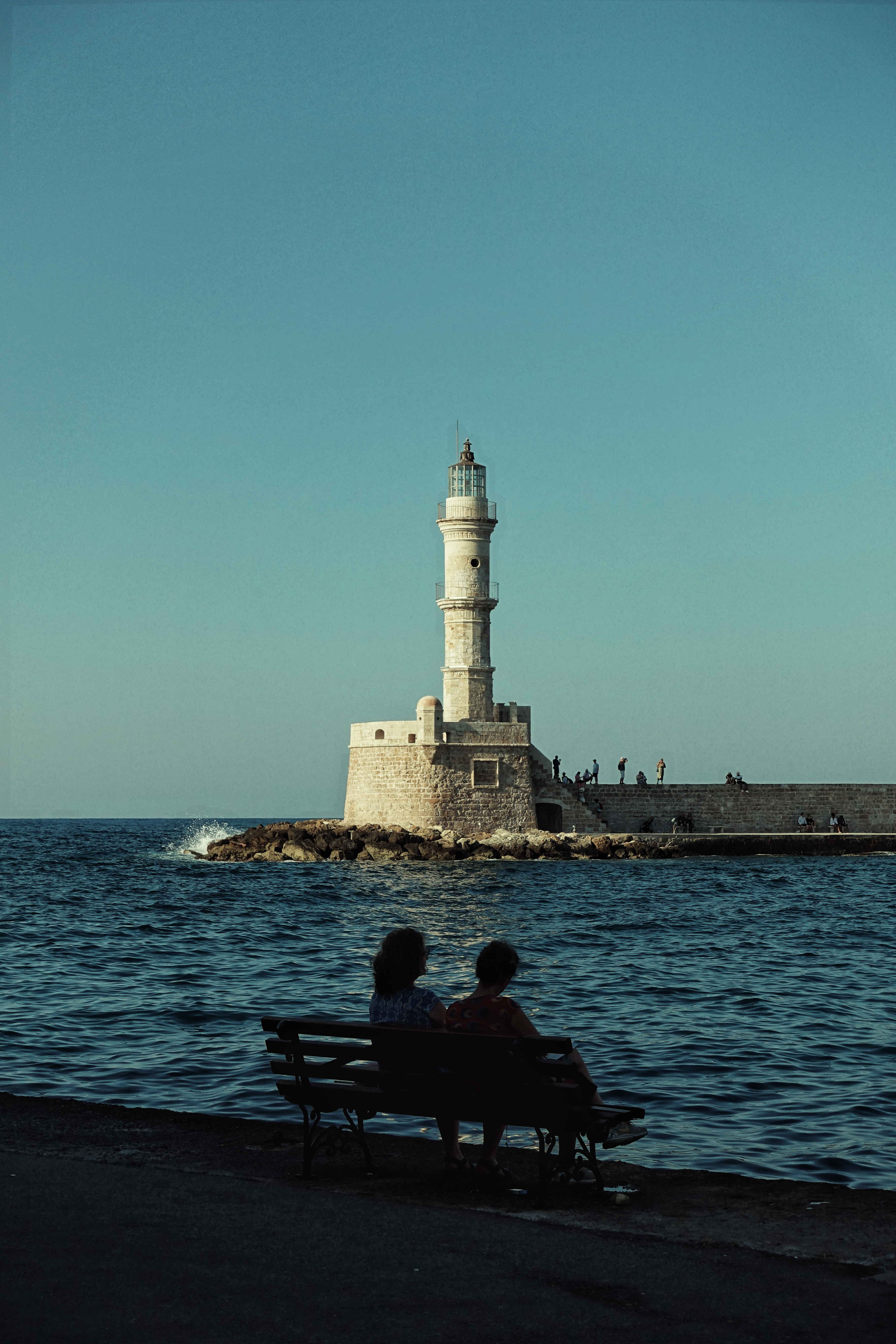 people sitting on bench