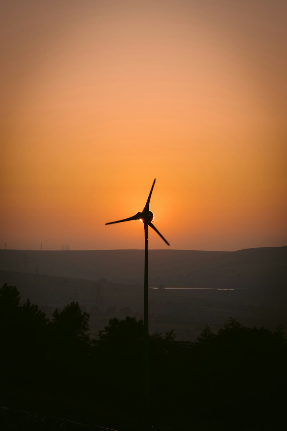 silhouette of a metal tower at sunset