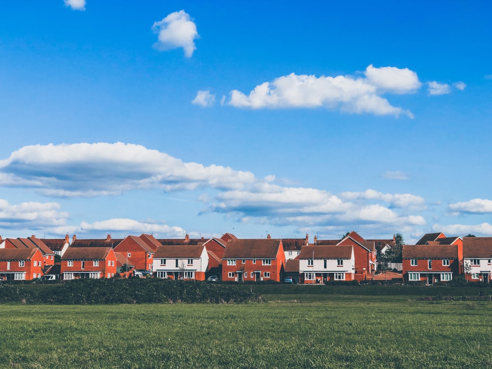 houses beside grass field