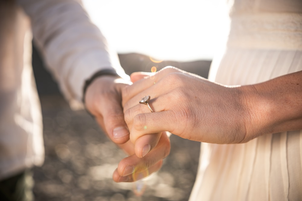 silver-colored ring close-up photography