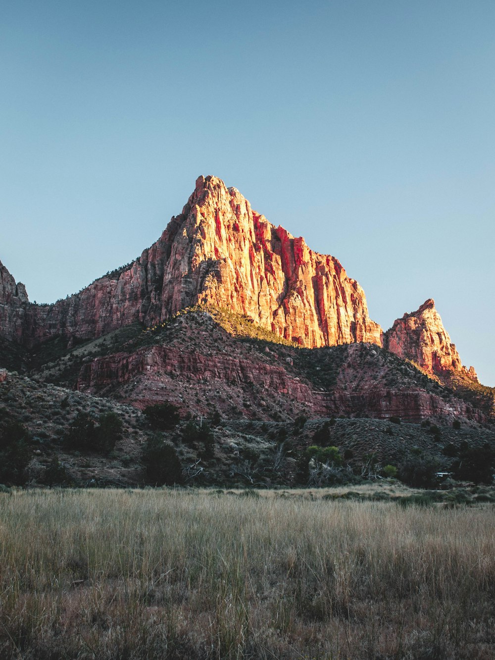 brown and green mountain under blue sky at daytime