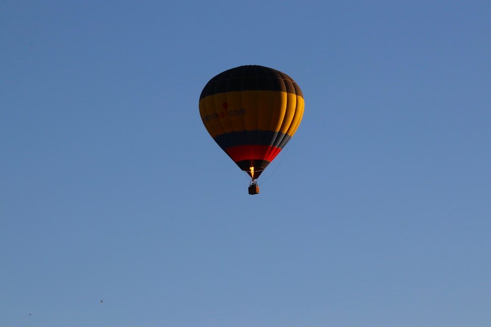 red, blue, and black hot air balloon