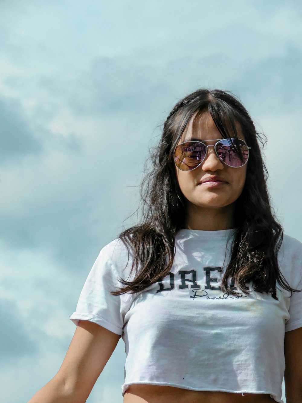 woman wearing crop top and sunglasses