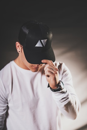 A person wearing a cap, showcasing its style.