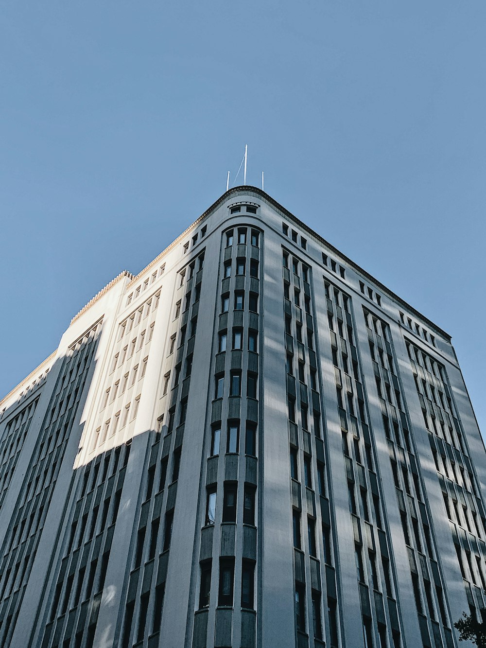 white and gray concrete building at daytime