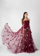 Luxurious luxury pret outfit in velvet maroon with flowing fabric on a model.