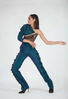 woman wearing blue dress dancing