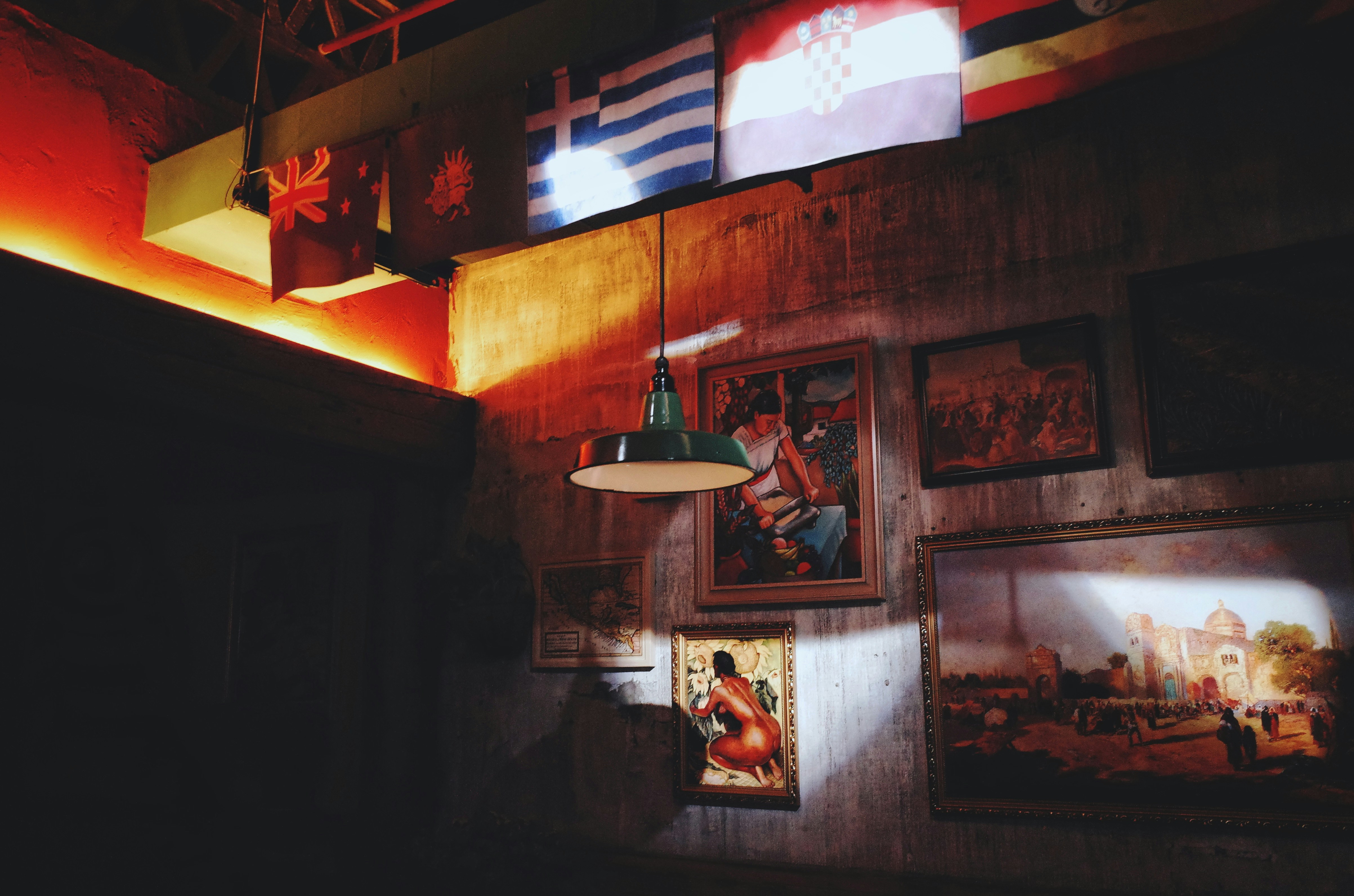 Pendant Lamp Under Four Flags Hanging On Ceiling Photo