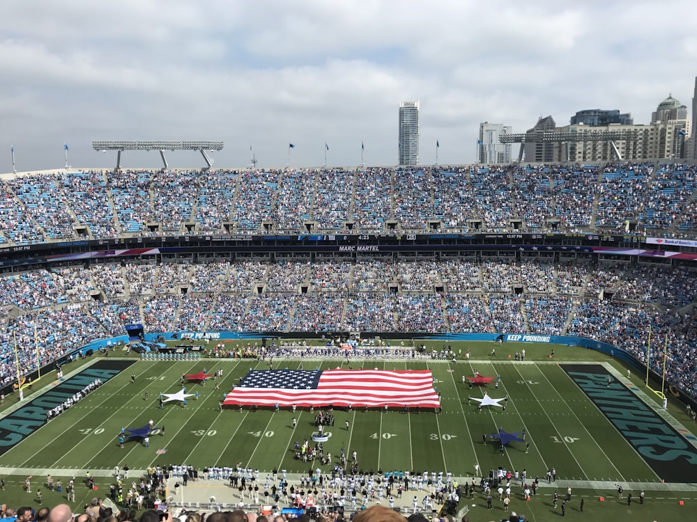 people walking on football field