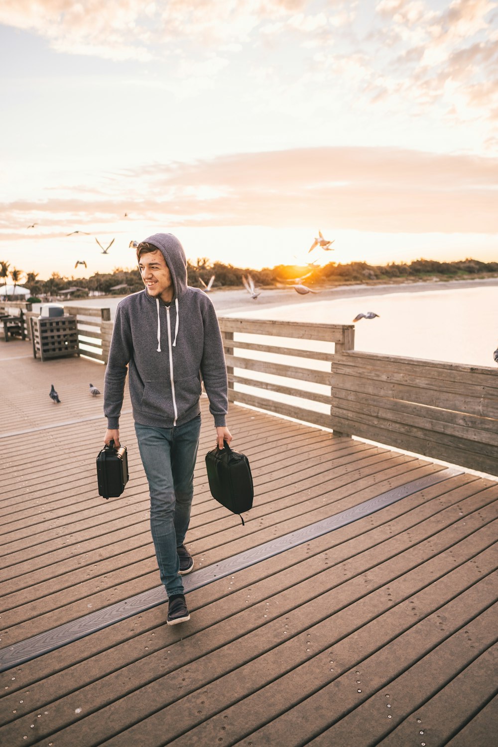 man walking on wooden dock