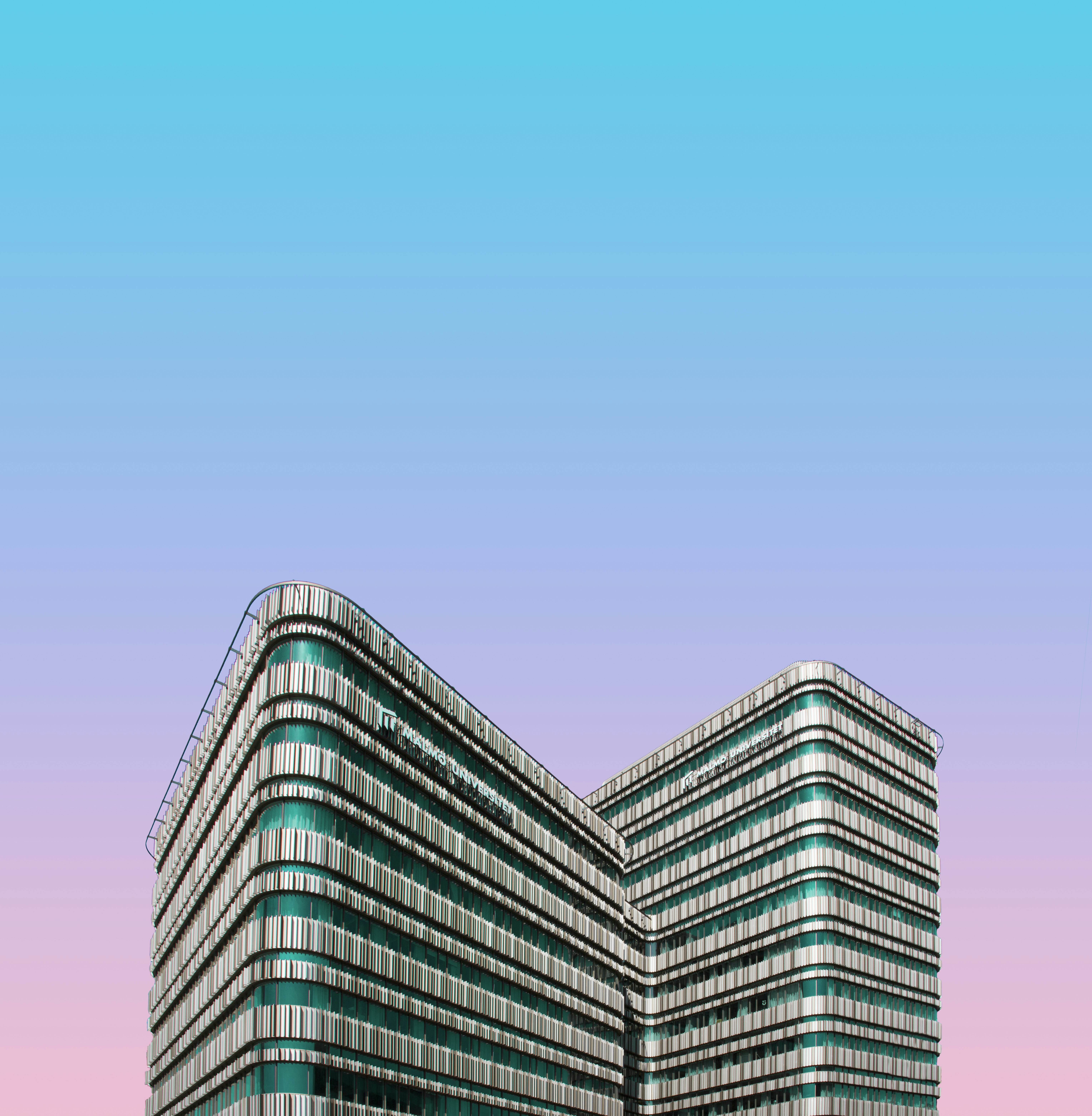 a very tall building with a sky background