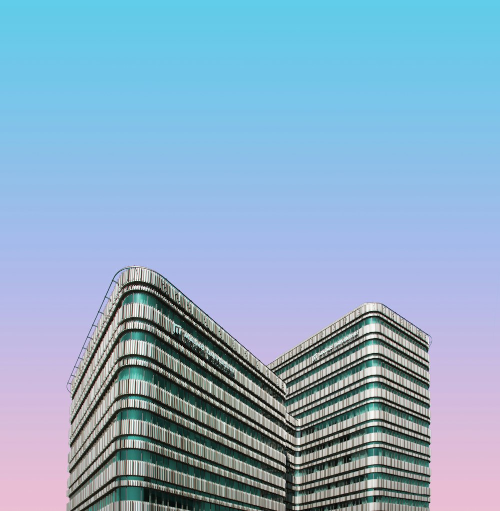 a very tall building with a sky background