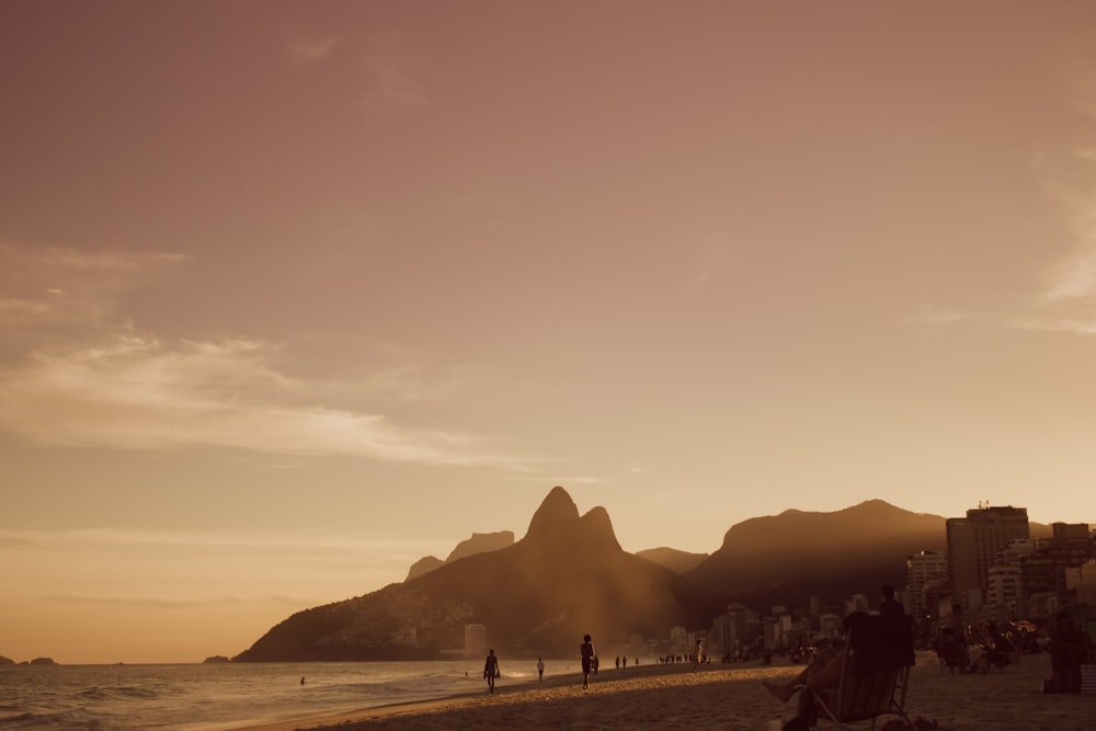 silhouette of person on seashore during daytime